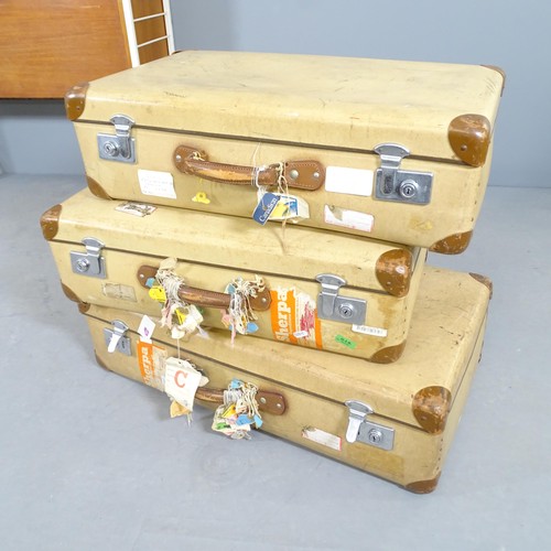 2749 - A set of 3 vintage suit cases with various world travel tags and labels etc. Largest - 75x21x44cm