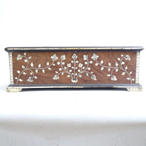 287 - A 19th century Indo-Portuguese writing box, teak and floral ivory inlaid, the rising top revealing a... 