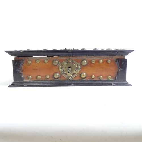 342 - A 19th century walnut and ebony travelling box, studded brass mounted, with fitted interior, with br... 