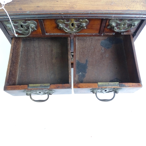 577 - An early 19th century table-top chest of 6 drawers of varying sizes, H29cm, L38cm, D20cm