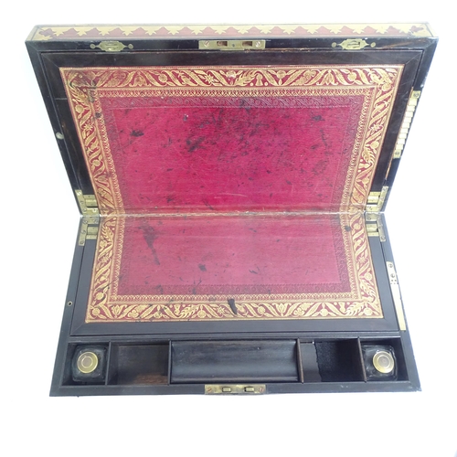 579 - A Victorian rosewood and brass-bound travelling writing slope, with associated inkwells, L46cm, H15c... 