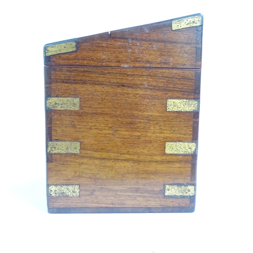 581 - A Victorian mahogany and brass-bound travelling stationery case, H27cm, L36cm, D21cm