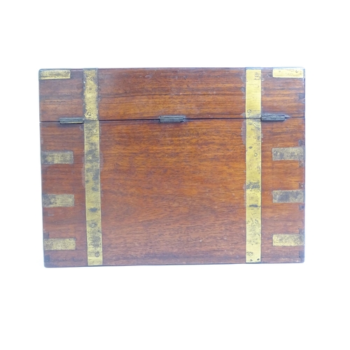 581 - A Victorian mahogany and brass-bound travelling stationery case, H27cm, L36cm, D21cm