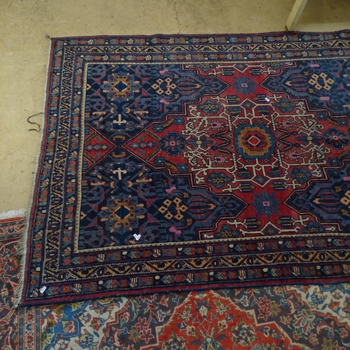 2344 - An antique red and blue-ground Persian prayer rug. 195x137cm.