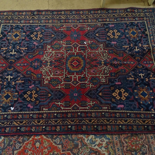 2344 - An antique red and blue-ground Persian prayer rug. 195x137cm.