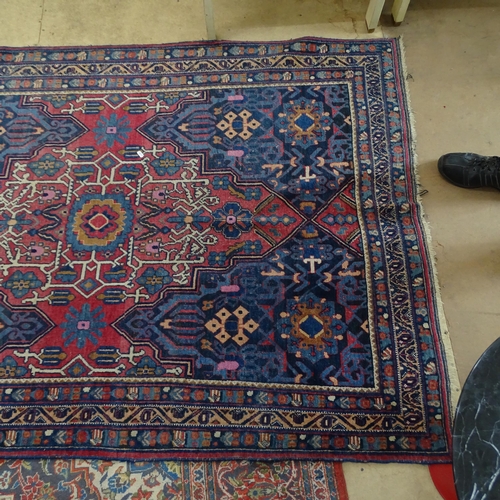 2344 - An antique red and blue-ground Persian prayer rug. 195x137cm.