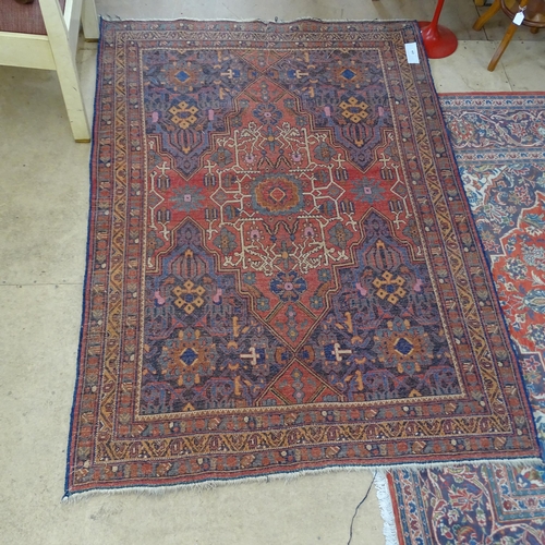 2344 - An antique red and blue-ground Persian prayer rug. 195x137cm.