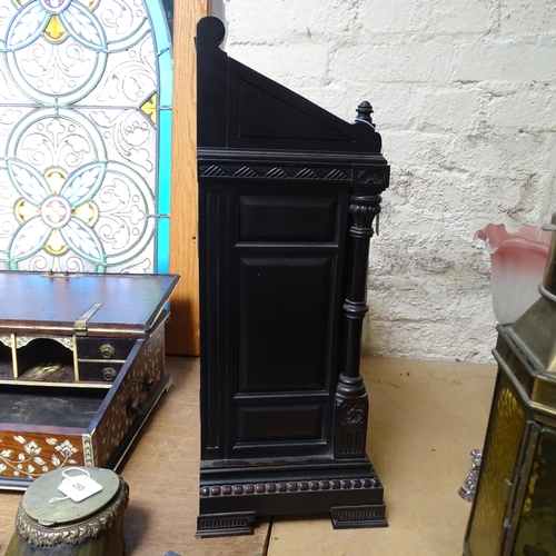 289 - A Victorian Aesthetic Movement ebonised architectural mantel clock, probably designed by Lewis Forem... 