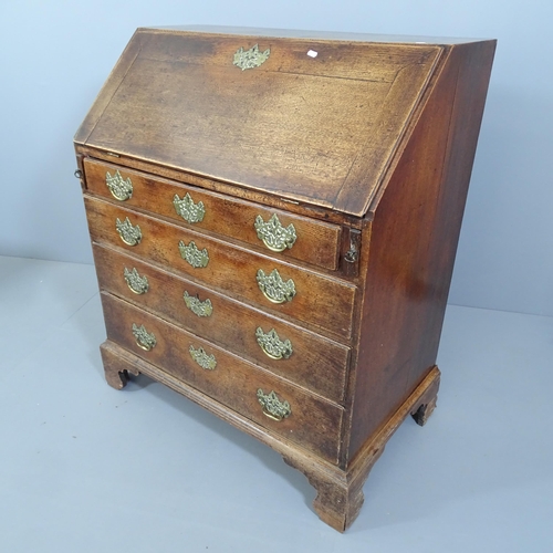 2107 - A Georgian oak bureau, the fall-front revealing a fitted interior with secret compartments, four lon... 