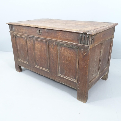 2052 - An 18th century panelled oak coffer. 116x67x60cm.