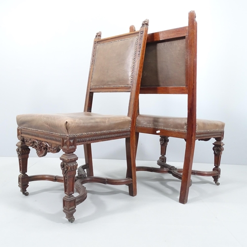 2057 - A pair of 19th century carved oak and leather upholstered Neo-Renaissance style dining chairs.