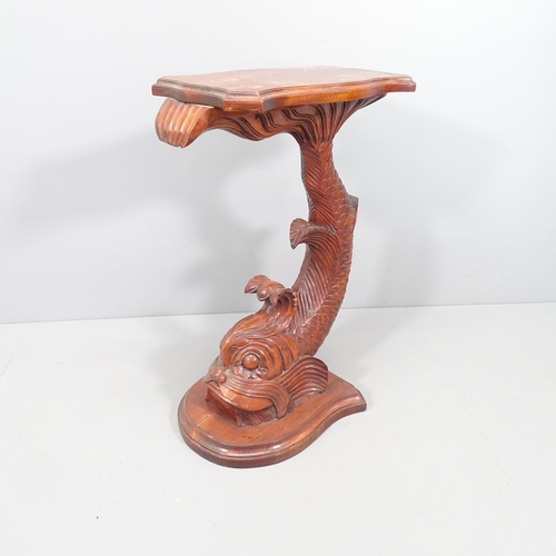 2058 - An oriental mahogany fish design side table. 55x78x40cm.