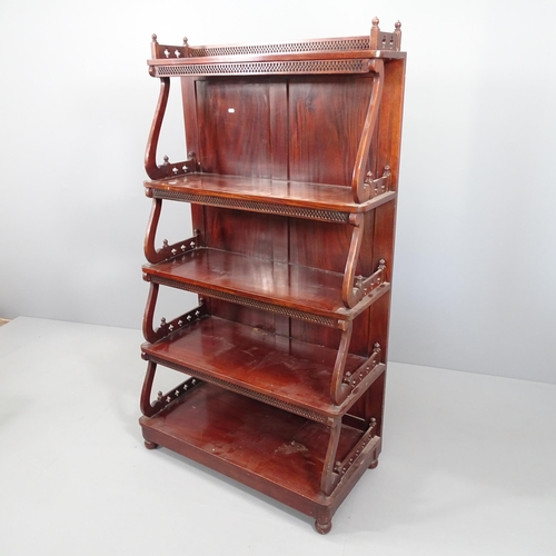 2060 - A Chippendale style five tier mahogany waterfall bookcase, each tier with pierced fretwork decoratio... 