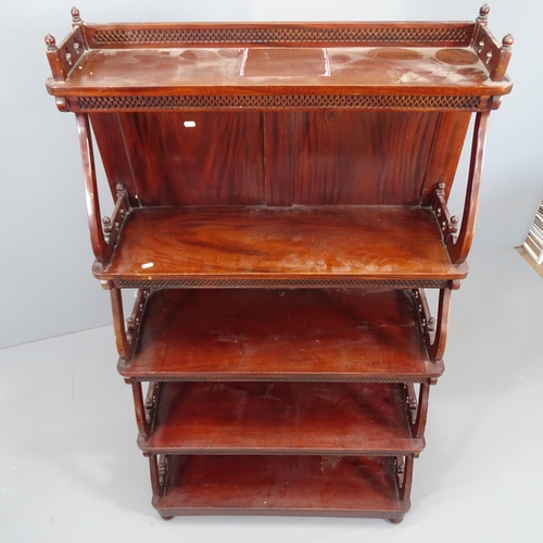 2060 - A Chippendale style five tier mahogany waterfall bookcase, each tier with pierced fretwork decoratio... 