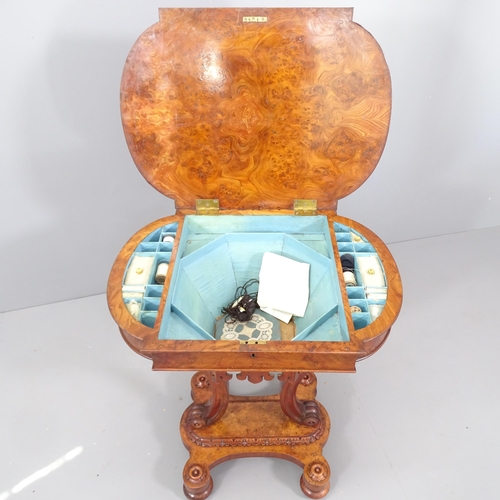 2062 - A Regency burr walnut sewing table. 63x74x46cm