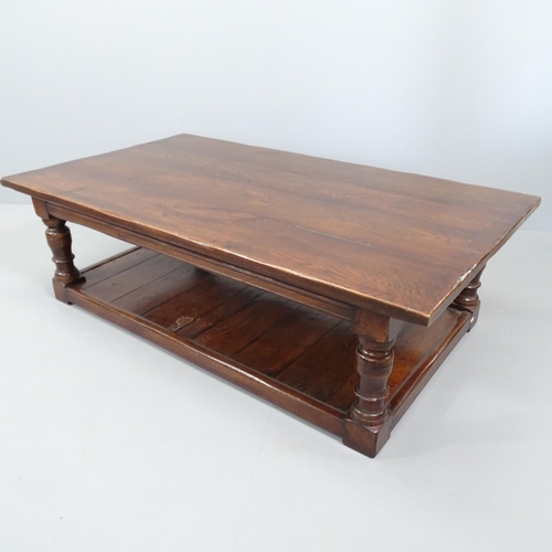 2068 - An antique oak two-tier plank top low coffee table. 153x46x86cm.