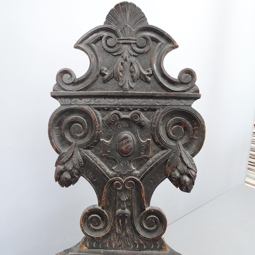 2072 - A 19th century Italian Renaissance Sgabello armorial carved oak hall chair, with green man decoratio... 