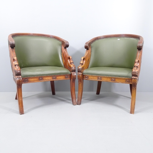 2073 - A pair of French Empire style walnut and mahogany studded faux-leather upholstered tub chairs. Overa... 