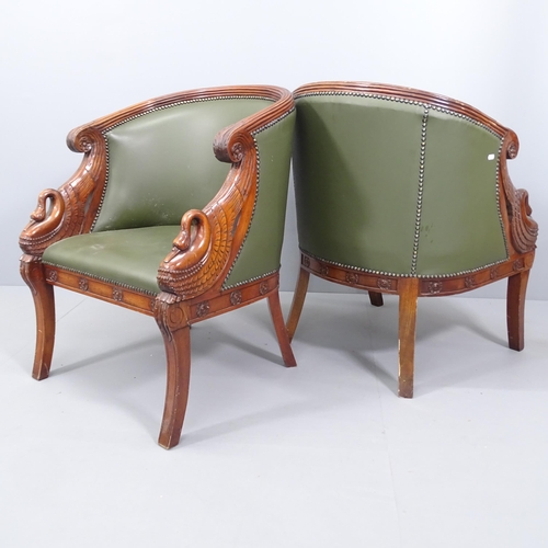 2073 - A pair of French Empire style walnut and mahogany studded faux-leather upholstered tub chairs. Overa... 