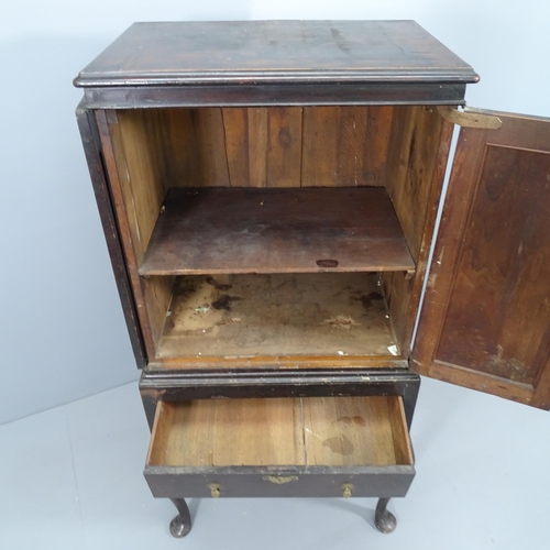 2081 - A 19th century two-section cabinet on stand, with two panelled doors revealing a shelved interior, s... 