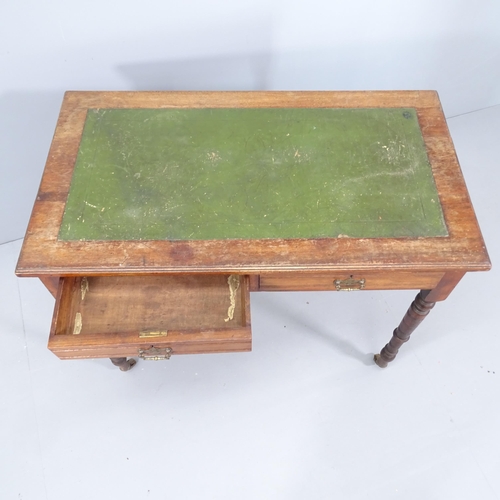 2095 - A Victorian mahogany writing table, with tooled green leather skiver, two frieze drawers and raised ... 