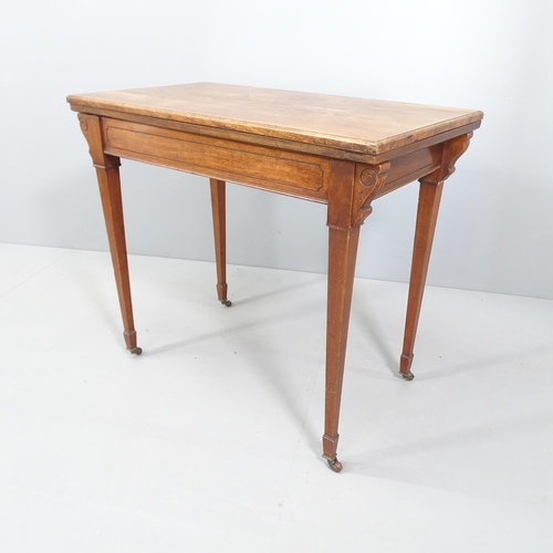 2097 - A Victorian mahogany fold-over card table, with applied carved decoration, square tapered legs and b... 