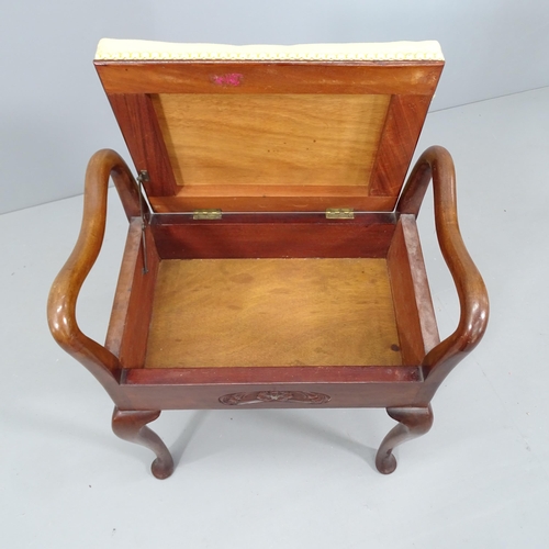 2098 - A 19th century mahogany and upholstered piano stool, with lifting seat and raised on tapered legs wi... 