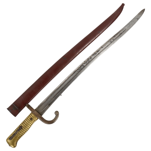 106 - A 19th century French brass-hilted sword bayonet with metal scabbard