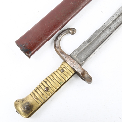 106 - A 19th century French brass-hilted sword bayonet with metal scabbard