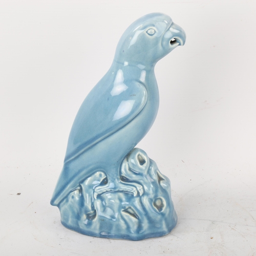 115 - Minton Majolica pale blue glazed parrot, height 22cm