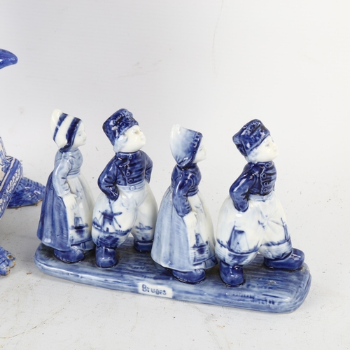 117 - A large Delft Pottery blue and white table centre flower stand, height 54cm, and a Delft group of ch... 