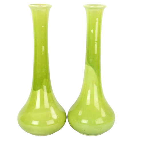 121 - A pair of pale green glaze Art pottery narrow-necked vases, impressed maker's marks, height 40cm