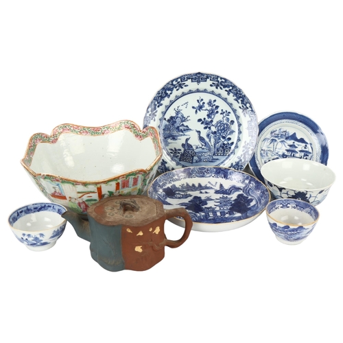 142 - A group of Oriental ceramics, including a famille rose porcelain fruit bowl, 24cm across (8)