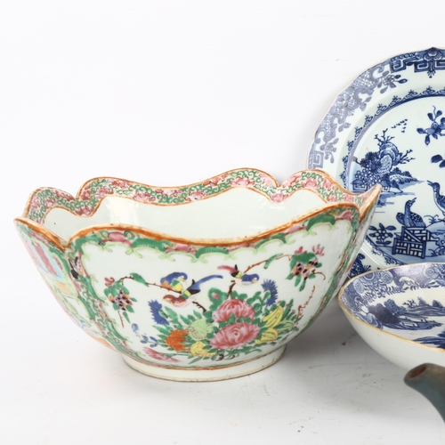 142 - A group of Oriental ceramics, including a famille rose porcelain fruit bowl, 24cm across (8)