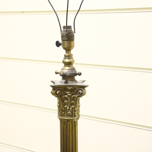 153 - A Victorian brass Corinthian column standard lamp, converted to electric, height to top of column 12... 