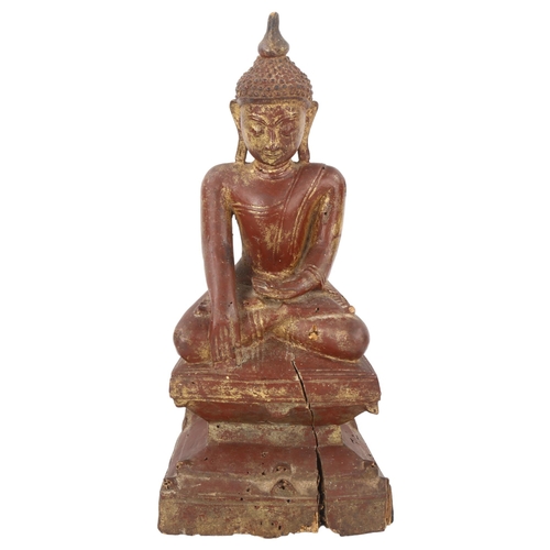 169 - A Burmese gilded and lacquered carved wood Buddha, 17th or 18th century, height 29cm