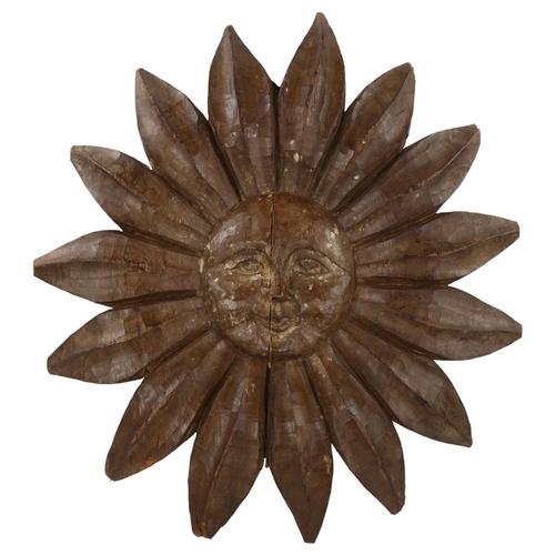 182 - A Folk Art carved wood sun motif, diameter 56cm