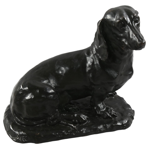 191 - A 20th century patinated bronze Dachshund seated dog, signed to base Carin Trygger, height 25cm, len... 