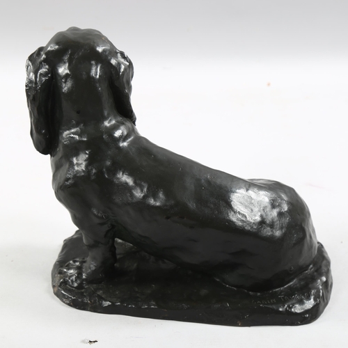 191 - A 20th century patinated bronze Dachshund seated dog, signed to base Carin Trygger, height 25cm, len... 