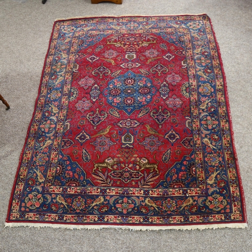 199 - An Antique Persian rug with bird borders, and bird and lion detail to central panel, 185cm x 142cm