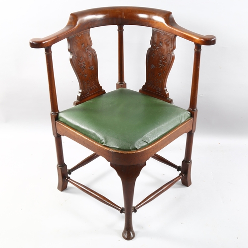 209 - A late 19th century mahogany corner chair, by Heal & Son, with carved splat, Heal label under seat, ... 