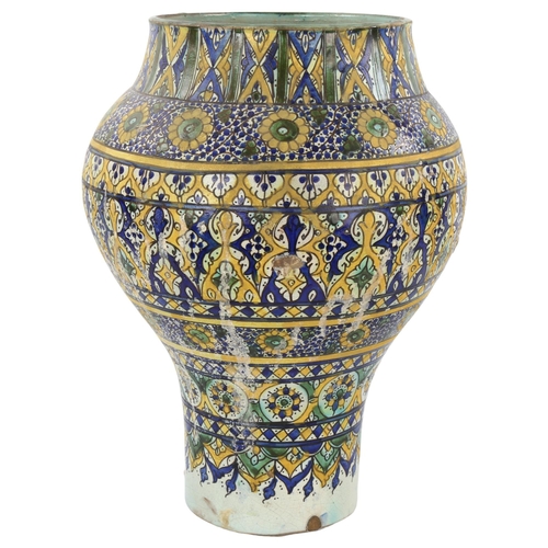 22 - A 19th century Moroccan Islamic pottery jar, with painted geometric designs, height 45cm