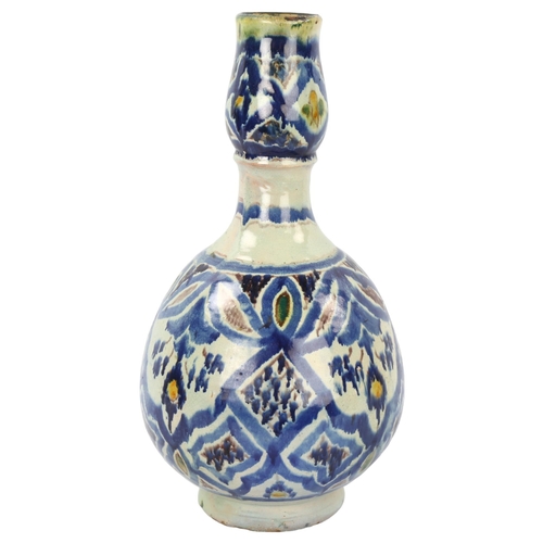 25 - A 19th century Moroccan Islamic pottery double-gourd vase, with painted decoration, height 33cm