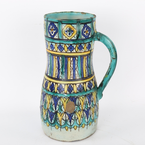 27 - A 19th century Moroccan Islamic tin-glaze pottery Ghorraf jug, height 26cm