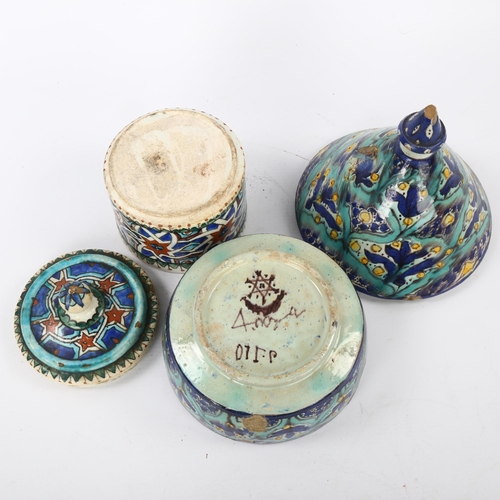 31 - 2  Moroccan Islamic pottery lidded bowls, largest height 20cm