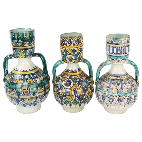 32 - 3 x 19th century Moroccan Islamic pottery Fez 2-handled vases, largest height 25cm (3)