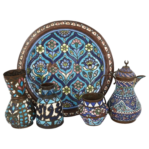 35 - A group of Islamic metalware with enamel decoration, including a charger, diameter 38cm, a wine ewer... 