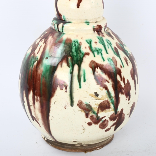 36 - A 19th century Turkish Ottoman Canakkale pottery vase, white body with green/brown splash glaze, hei... 