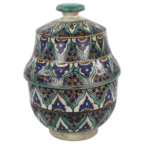 37 - A Moroccan Islamic pottery jar and cover with hand painted decoration, height 33cm