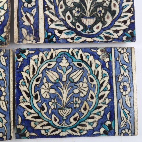 39 - A set of 4 Islamic pottery tiles, with hand painted decoration, 20cm x 27cm (4)
